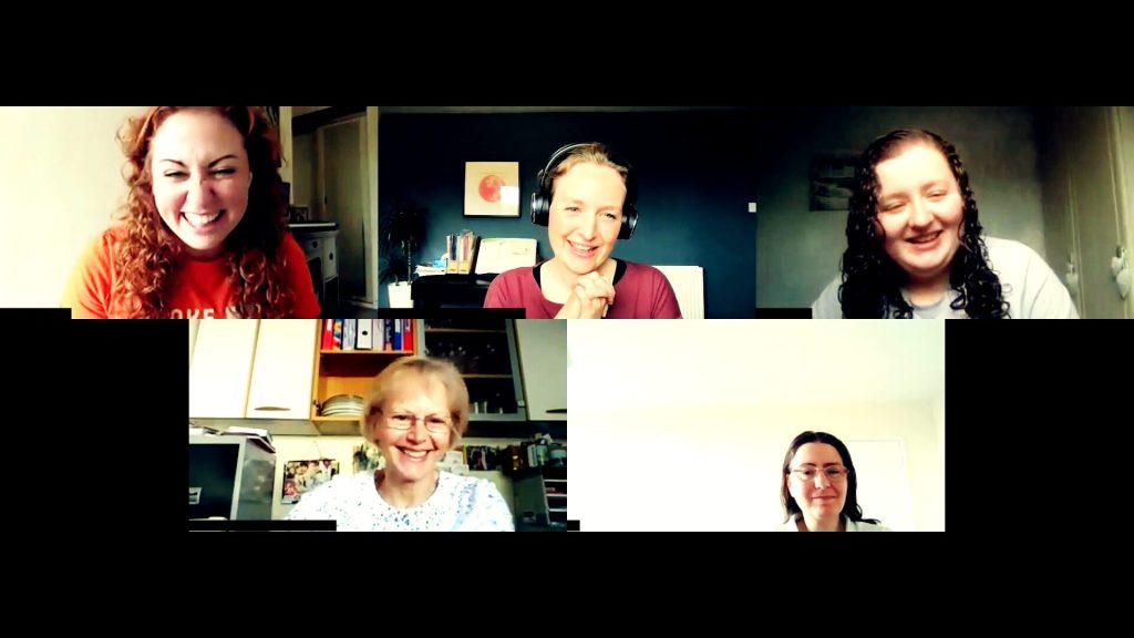 Screenshot of a zoom meeting with 5 white women of varying ages smiling.