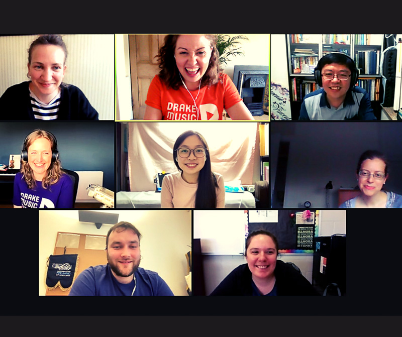 8 smiling faces on a Zoom call screen