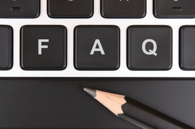 A close up of a computer keyboard keys labelled F, A, and Q. A pencil rests on the spacebar underneath.